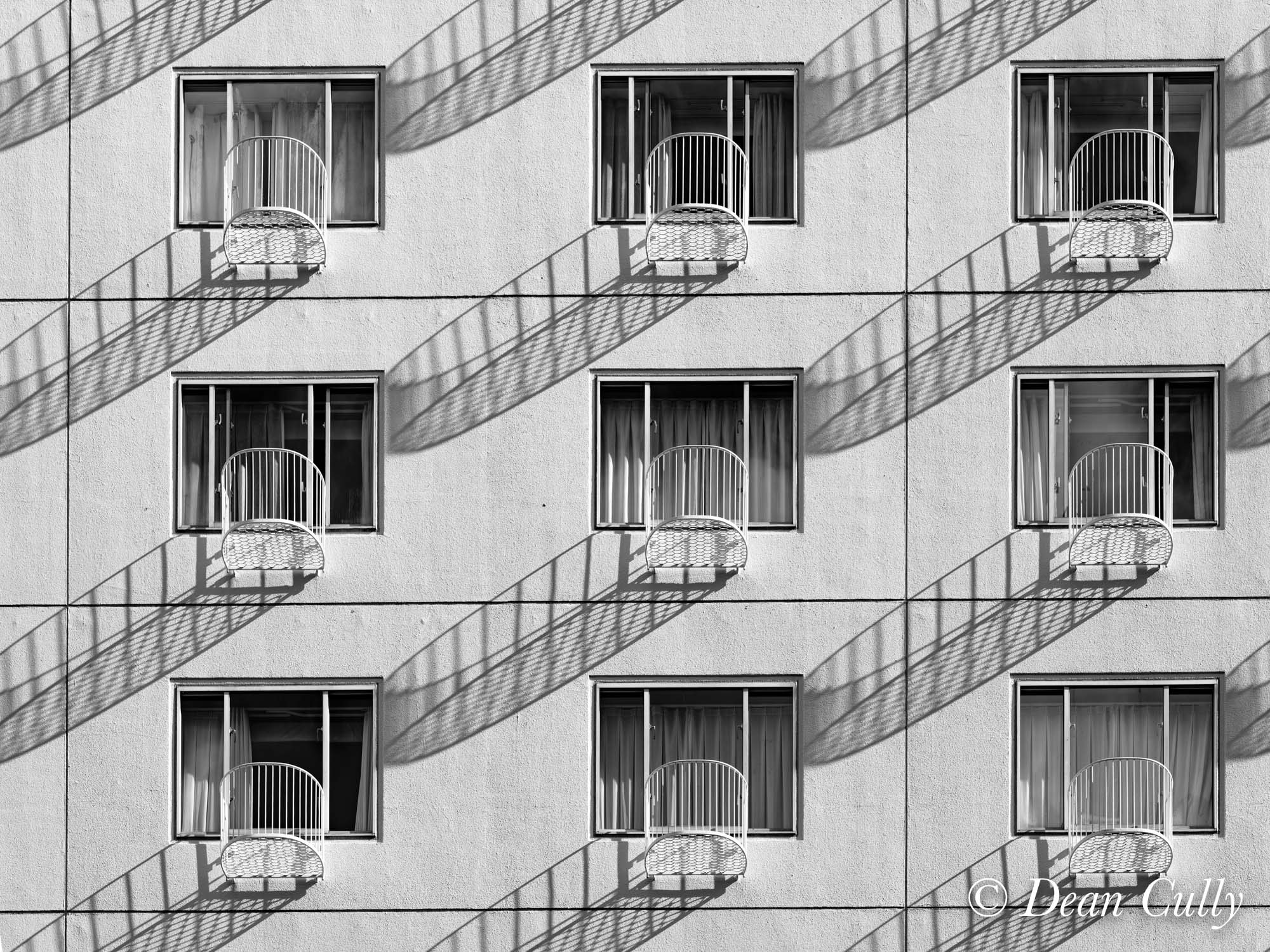 architecture_repetition_shadows_apartment_windows_japan_deancully_0318a