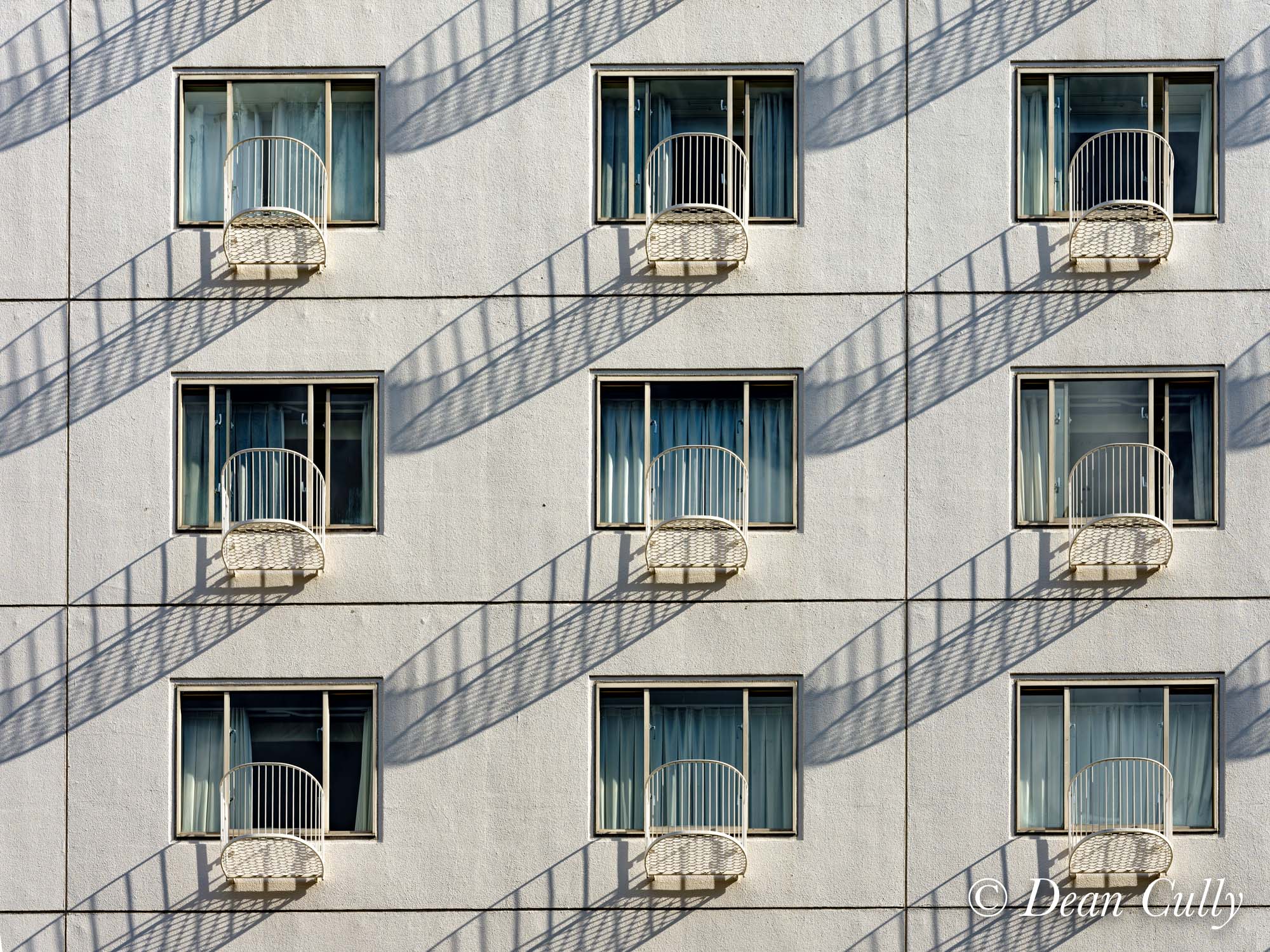 architecture_repetition_shadows_apartment_windows_japan_deancully_0318